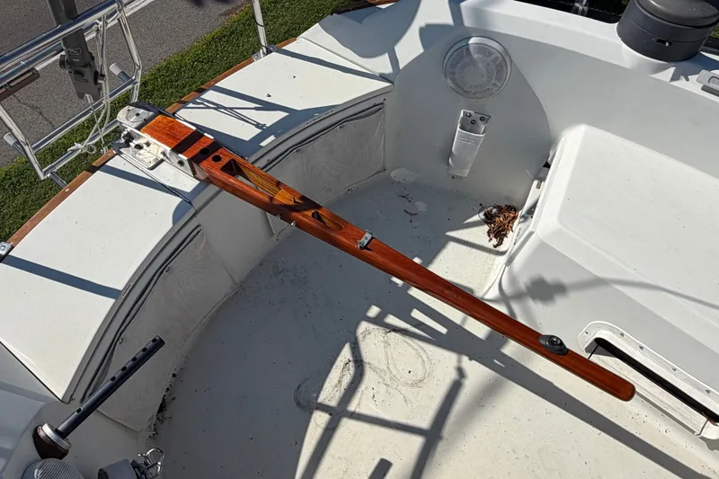 Slide: The Image of Cockpit of 1984 C&C 33 MK II sailboat with wooden tiller and clean deck. - 6