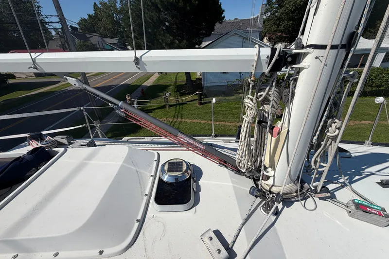 Slide: The Image of Deck view of a 1984 C&C 33 MK II sailboat, showcasing rigging and mast details. - 20