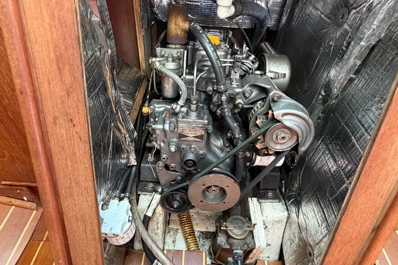 Slide: The Image of Engine compartment of a 1984 C&C 33 MK II sailboat, showcasing detailed mechanical components. - 64