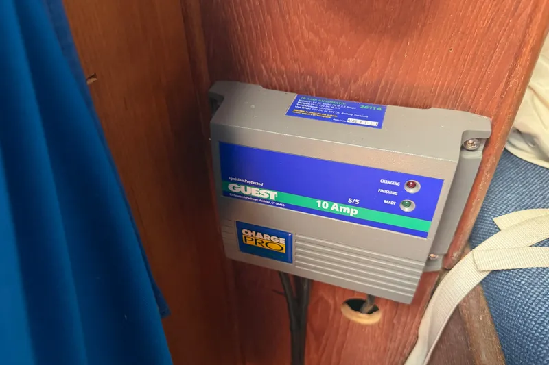 Slide: The Image of Battery charger installed on a 1984 C&C 33 MK II sailboat, labeled "Guest 10 Amp." - 61