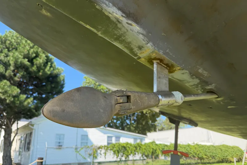 Slide: The Image of Close-up of a 1984 C&C 33 MK II sailboat's propeller and rudder mechanism. - 4