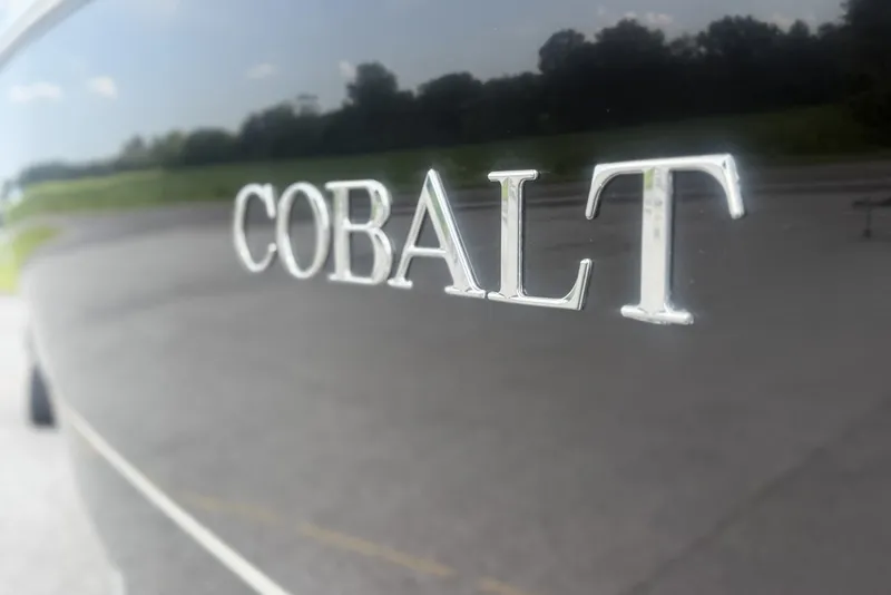 Slide: The Image of 2017 Cobalt R3 logo on sleek black surface, outdoors. - 3