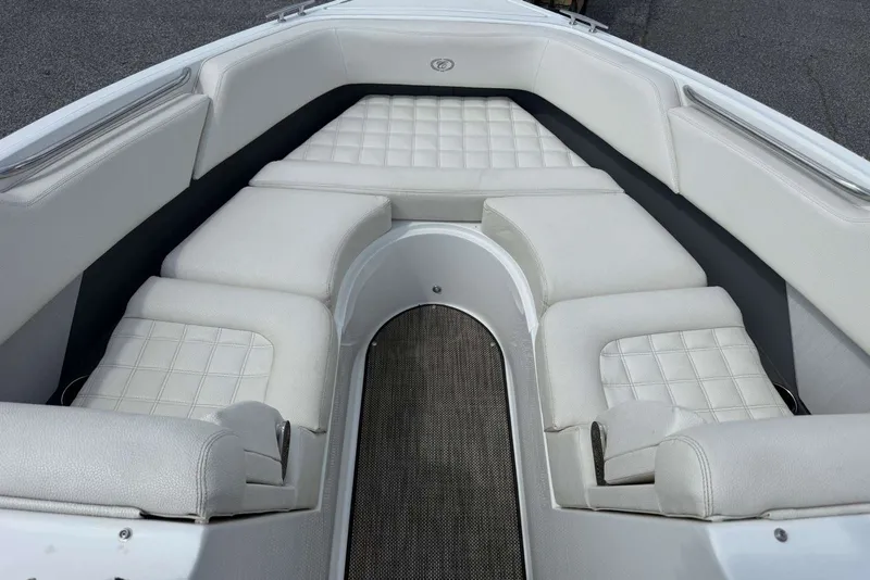 Slide: The Image of Interior seating of a 2017 Cobalt R3 boat with white cushioned upholstery. - 20