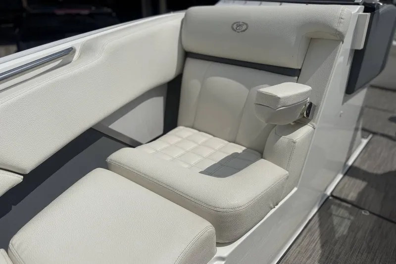 Slide: The Image of Luxurious white seating on a 2017 Cobalt R3 boat, featuring plush upholstery and armrest. - 9