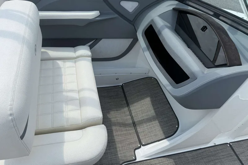 Slide: The Image of Interior of a 2017 Cobalt R3 boat with white seating and gray accents. - 25