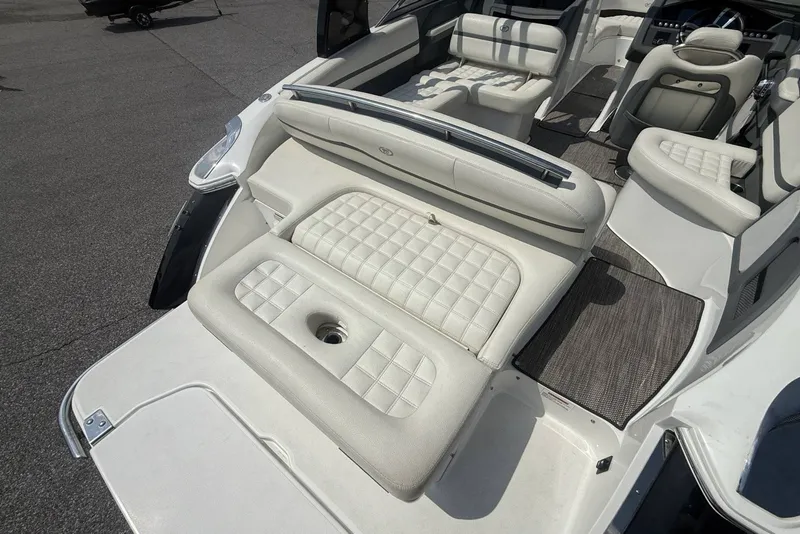 Slide: The Image of 2017 Cobalt R3 boat interior with white cushioned seating and sleek design. - 32
