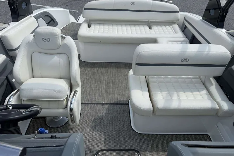 Slide: The Image of 2017 Cobalt R3 boat interior with white leather seating and steering wheel. - 22