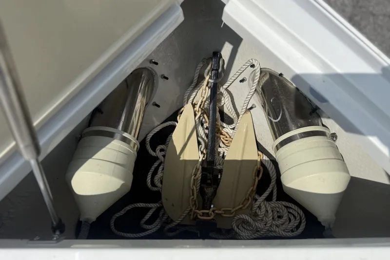 Slide: The Image of Anchor and ropes in a 2017 Cobalt R3 boat storage compartment. - 8