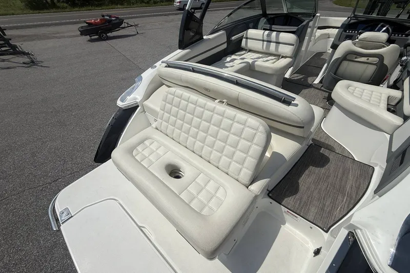 Slide: The Image of 2017 Cobalt R3 boat interior with white cushioned seating and open deck layout. - 31