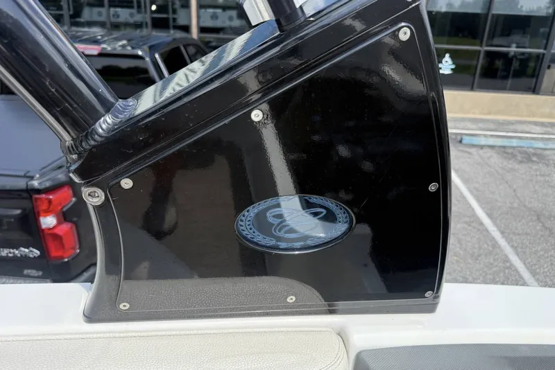 Slide: The Image of 2017 Cobalt R3 boat detail with black panel and logo in parking lot. - 30