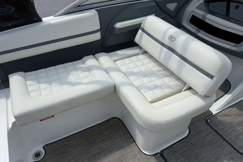 Slide: The Image of 2017 Cobalt R3 boat interior with white cushioned seating and modern design. - 28