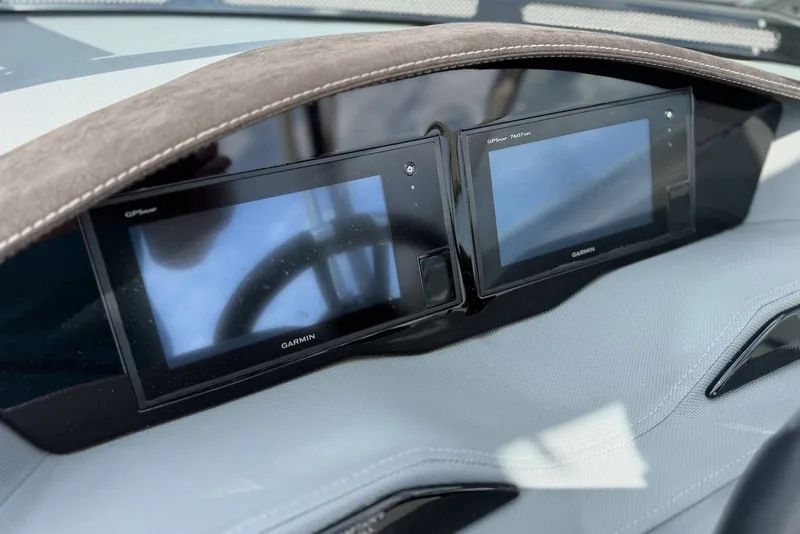 Slide: The Image of Dashboard of a 2017 Cobalt R3 featuring dual Garmin GPS displays. - 16