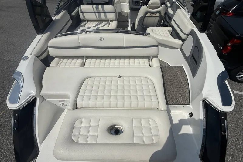 Slide: The Image of 2017 Cobalt R3 boat interior with white cushioned seating and sleek design. - 33