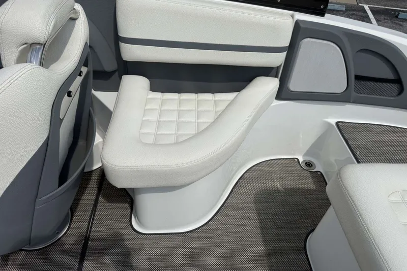 Slide: The Image of Interior seating of a 2017 Cobalt R3 boat, featuring gray and white upholstery. - 23