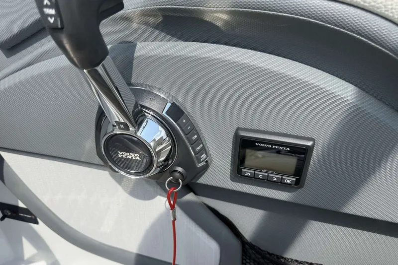Slide: The Image of Volvo Penta throttle control and display on 2017 Cobalt R3 boat dashboard. - 29