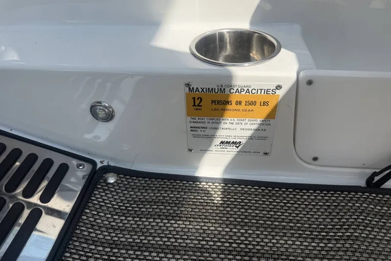 Slide: The Image of 2017 Cobalt R3 boat capacity plate, 12 persons or 1500 lbs, U.S. Coast Guard compliant. - 34