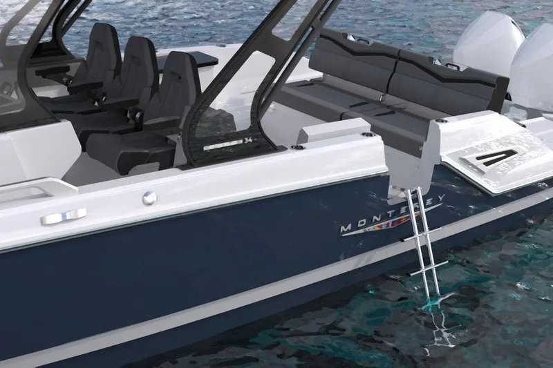 Slide: The Image of 2027 Monterey Elite 34 OB boat with sleek design, spacious seating, and swim ladder. - 13