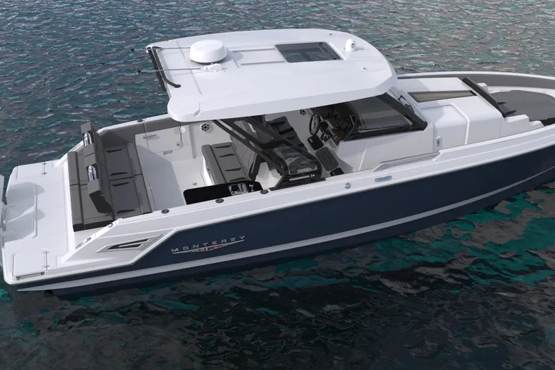 Slide: The Image of 2027 Monterey Elite 34 OB boat on water, showcasing sleek design and spacious interior. - 11