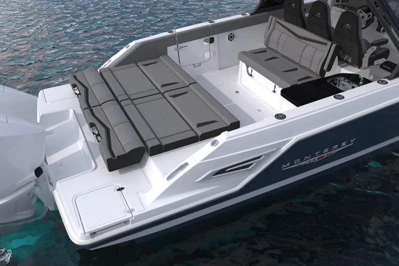 Slide: The Image of 2027 Monterey Elite 34 OB boat with sleek seating and modern design on water. - 10