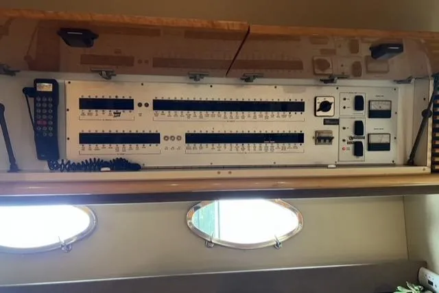 Slide: The Image of Electrical panel inside a 1994 Sunseeker Camargue 55 yacht, featuring control switches and meters. - 8