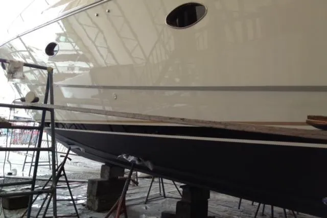 Slide: The Image of 1994 Sunseeker Camargue 55 yacht in dry dock, side view. - 19