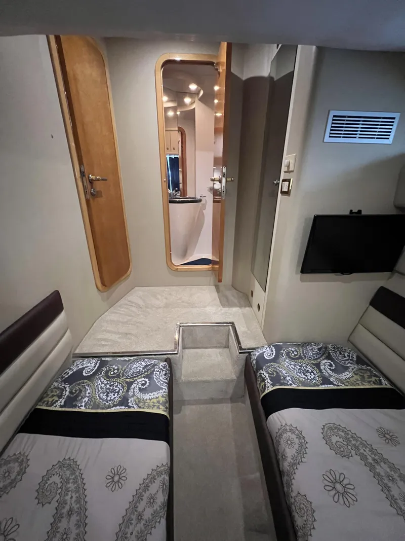 Slide: The Image of Interior cabin of 1994 Sunseeker Camargue 55 yacht with twin beds and modern decor. - 18