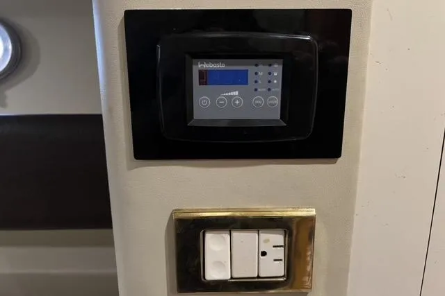 Slide: The Image of Control panel and switches inside a 1994 Sunseeker Camargue 55 yacht. - 16