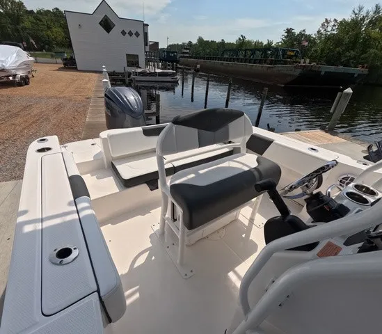 Slide: The Image of The image shows the cockpit of a 2027 Robalo Explorer R202EX with bench seating and a helm console. - 15