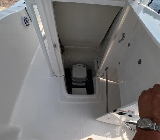 Slide: The Image of The image shows the interior of a 2027 Robalo Explorer R202EX featuring a toilet. - 27