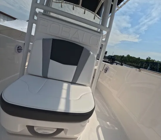 Slide: The Image of The image shows the seating area of a 2027 Robalo Explorer R202EX with white and gray upholstery. - 26