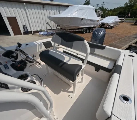 Slide: The Image of The image shows the cockpit of a 2027 Robalo Explorer R202EX with a cushioned bench seat. - 14