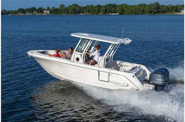Slide: The Image of A 2021 Robalo R272 Center Console boat speeding across the water. - 14
