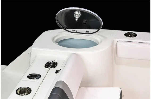 Slide: The Image of Close-up of a white boat console area with a round, open compartment lid. - 28