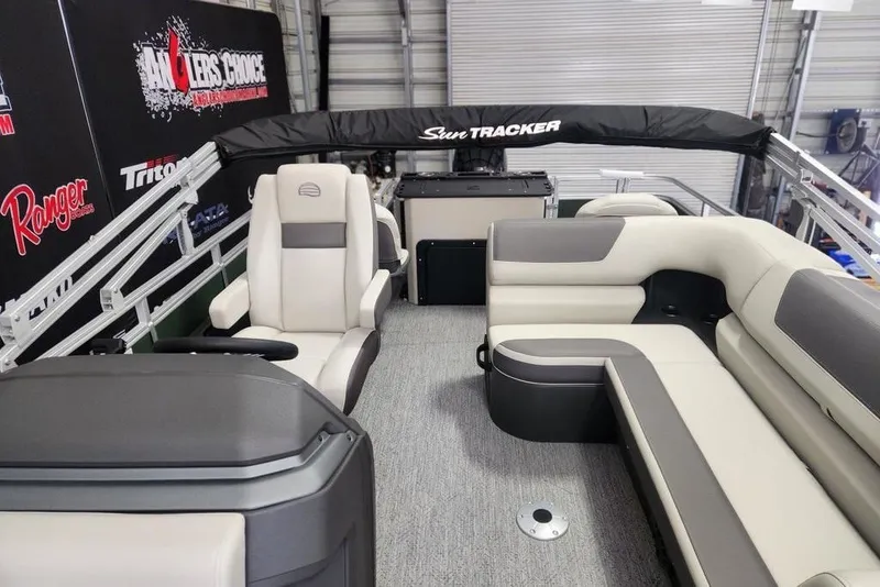 Slide: The Image of 2027 Sun Tracker Fishin' Barge 22 DLX interior with plush seating and modern design. - 15