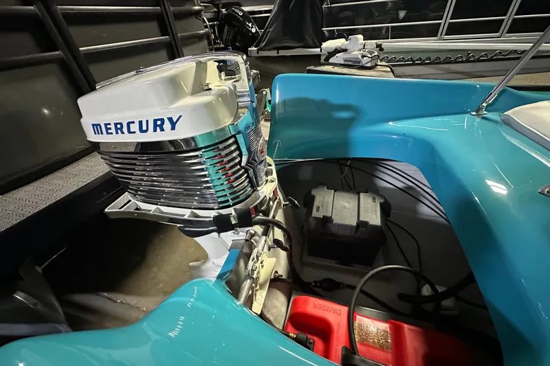 Slide: The Image of 1959 Seafury 14' Antique boat with Mercury outboard motor, turquoise interior. - 10