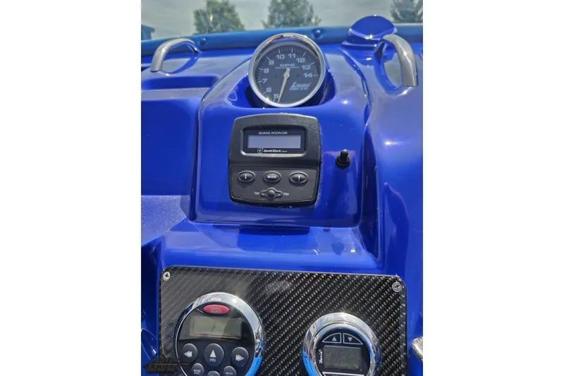 Slide: The Image of Dashboard of a 2010 Nor-Tech 4300V boat with gauges and controls. - 75
