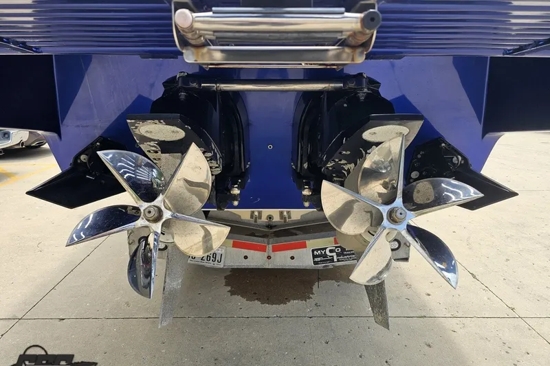 Slide: The Image of 2010 Nor-Tech 4300V boat propellers and stern, showcasing dual propeller system. - 35