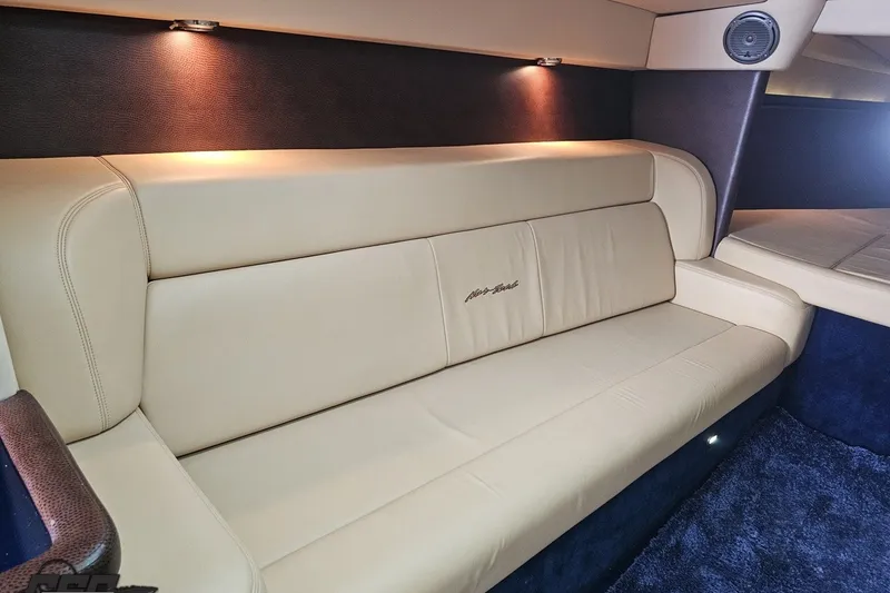 Slide: The Image of Luxurious beige leather seating in 2010 Nor-Tech 4300V boat interior. - 83