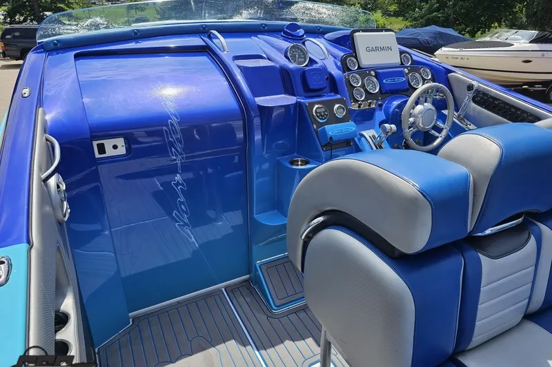 Slide: The Image of Blue interior of a 2010 Nor-Tech 4300V boat with Garmin navigation system. - 67