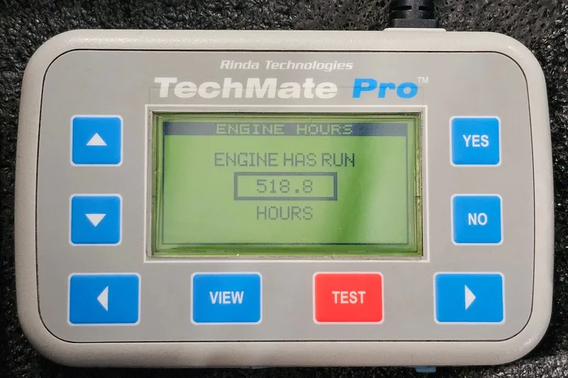 Slide: The Image of TechMate Pro engine diagnostic tool displaying 518.8 engine hours for 2010 Nor-Tech 4300V. - 108