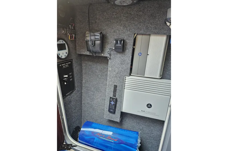 Slide: The Image of Interior electronics of a 2010 Nor-Tech 4300V boat, featuring control panels and audio equipment. - 94