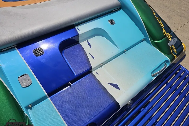 Slide: The Image of Colorful rear deck of a 2010 Nor-Tech 4300V boat with vibrant design. - 48