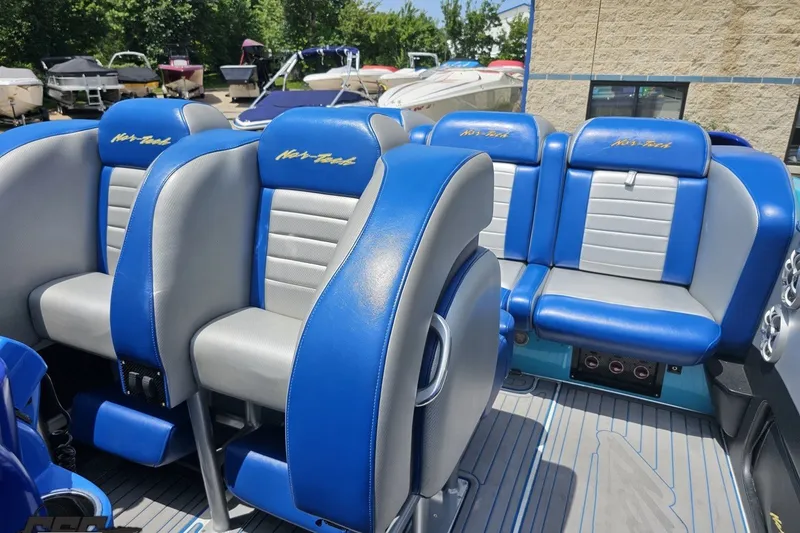 Slide: The Image of Interior of 2010 Nor-Tech 4300V boat with blue and gray seating. - 96