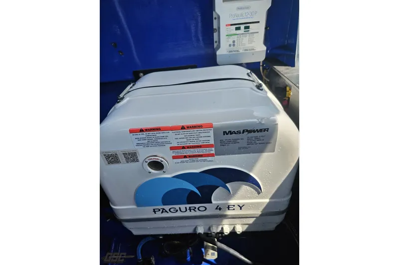 Slide: The Image of Paguro 4 EY generator in a 2010 Nor-Tech 4300V boat, featuring Mas Power branding. - 106