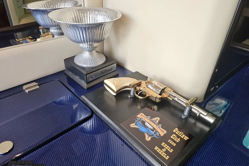 Slide: The Image of Trophy and revolver display on Nor-Tech 4300V boat, 2010 model. - 85