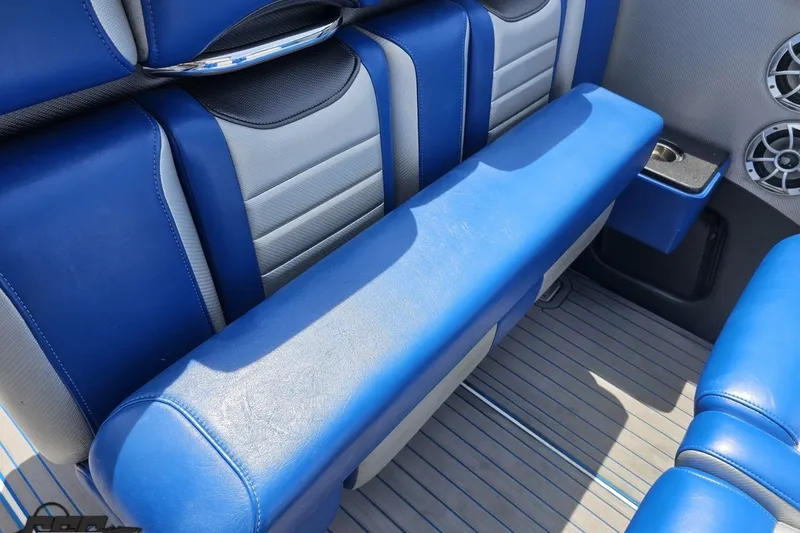 Slide: The Image of Blue and gray seating in 2010 Nor-Tech 4300V boat interior with speaker detail. - 64