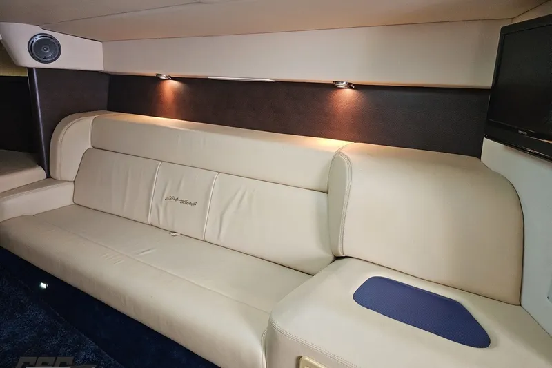 Slide: The Image of Luxurious interior of 2010 Nor-Tech 4300V boat with beige leather seating and ambient lighting. - 82