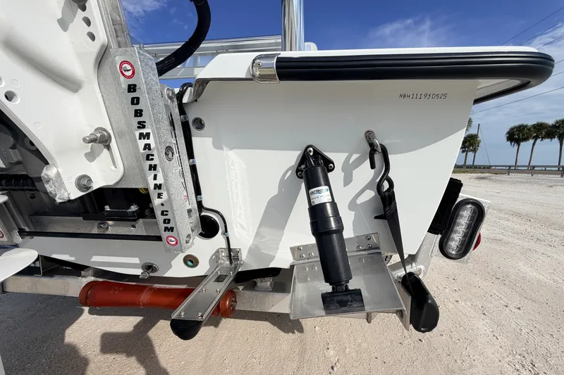 Slide: The Image of 2021 Hell's Bay Marathon boat transom with hydraulic components and branding. - 27