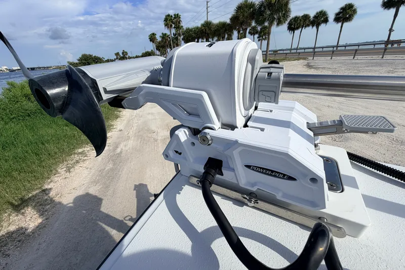Slide: The Image of 2021 Hell's Bay Marathon boat with Power-Pole anchor system, scenic waterfront view. - 37