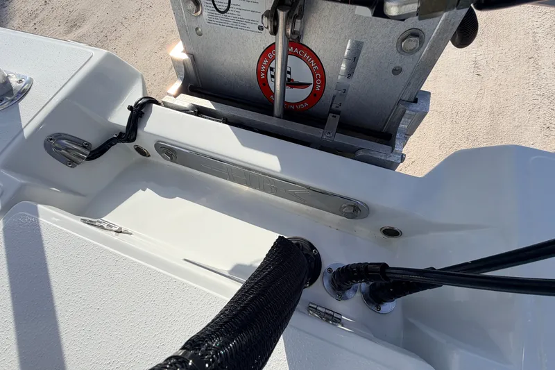 Slide: The Image of 2021 Hell's Bay Marathon boat detail showing engine mount and wiring connections. - 77